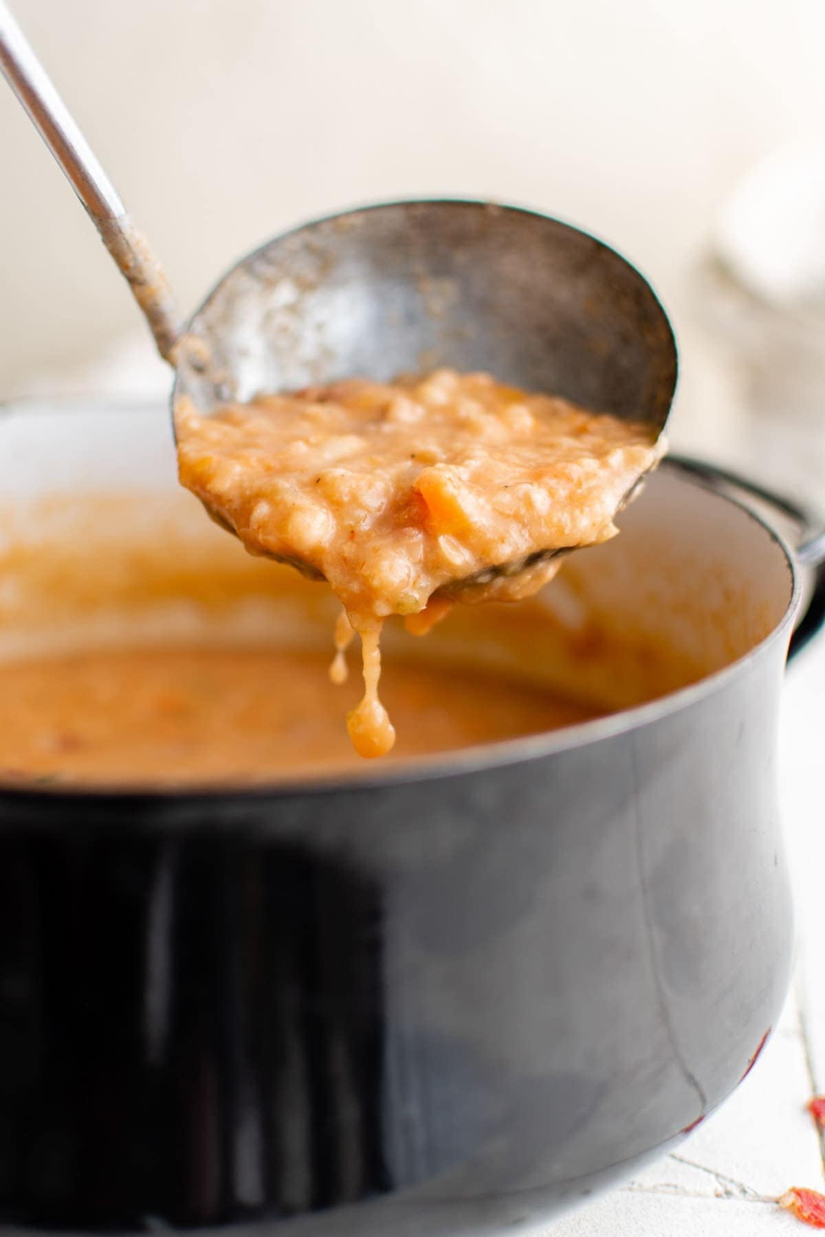 ladle pouring out soup