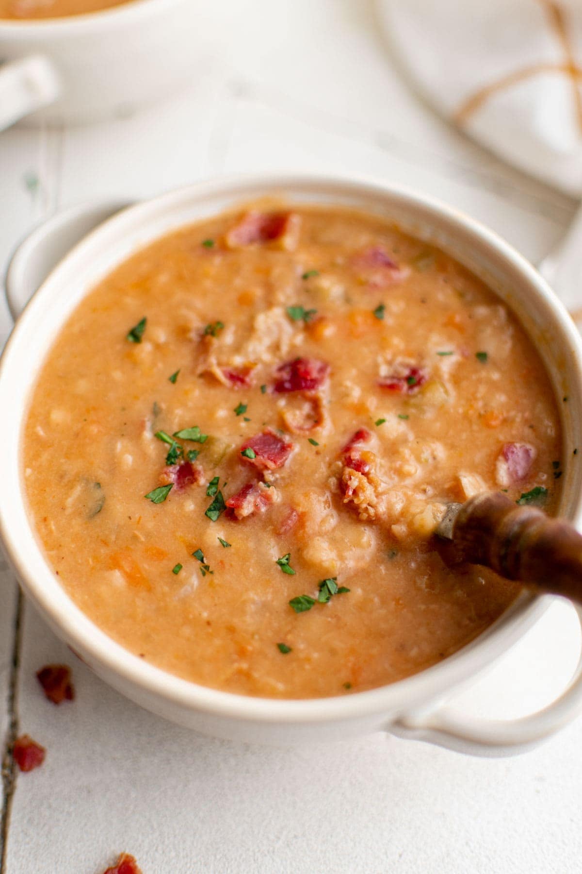 bowl of bean soup with a sppoon