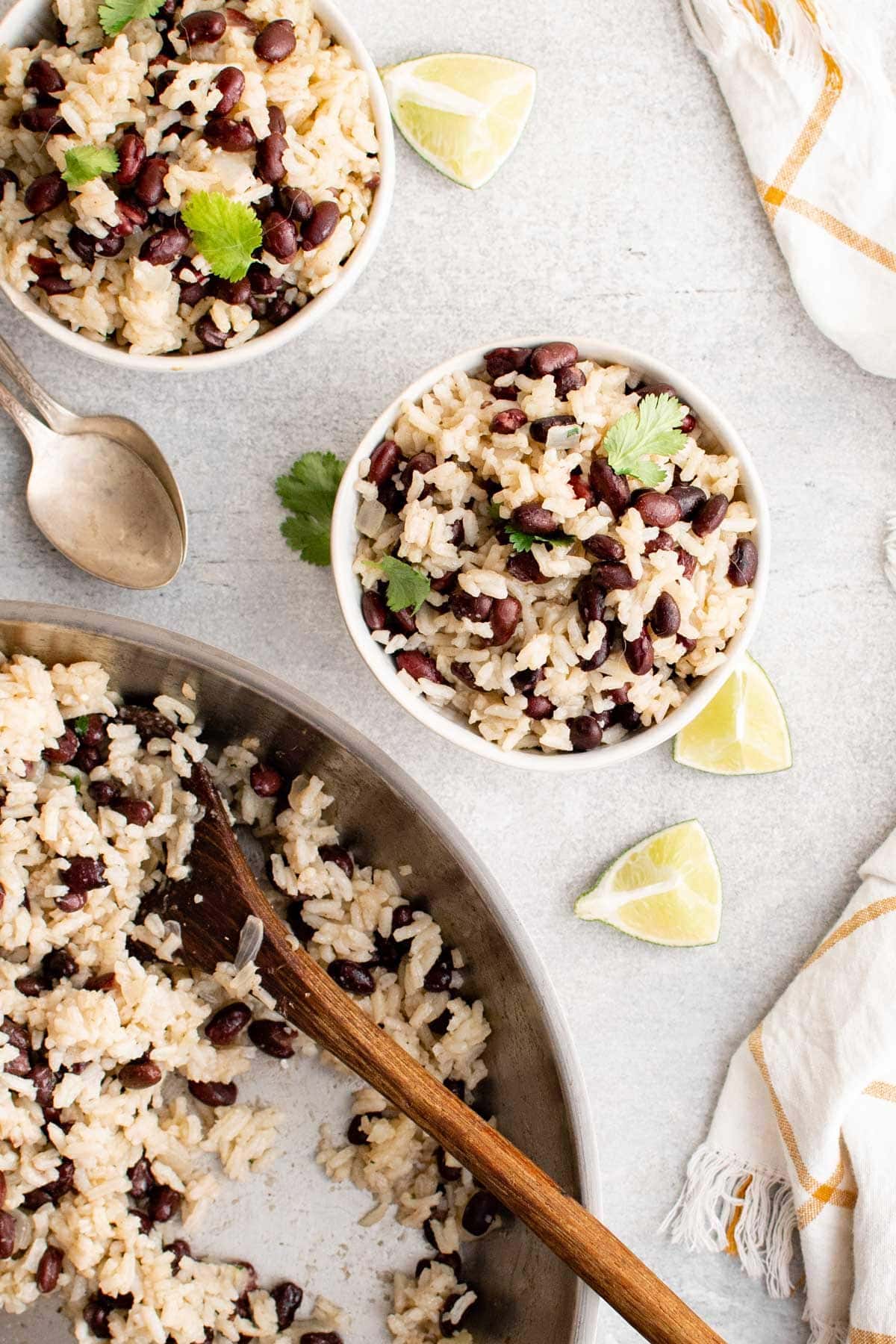 skillet and bowls with rice and black beans