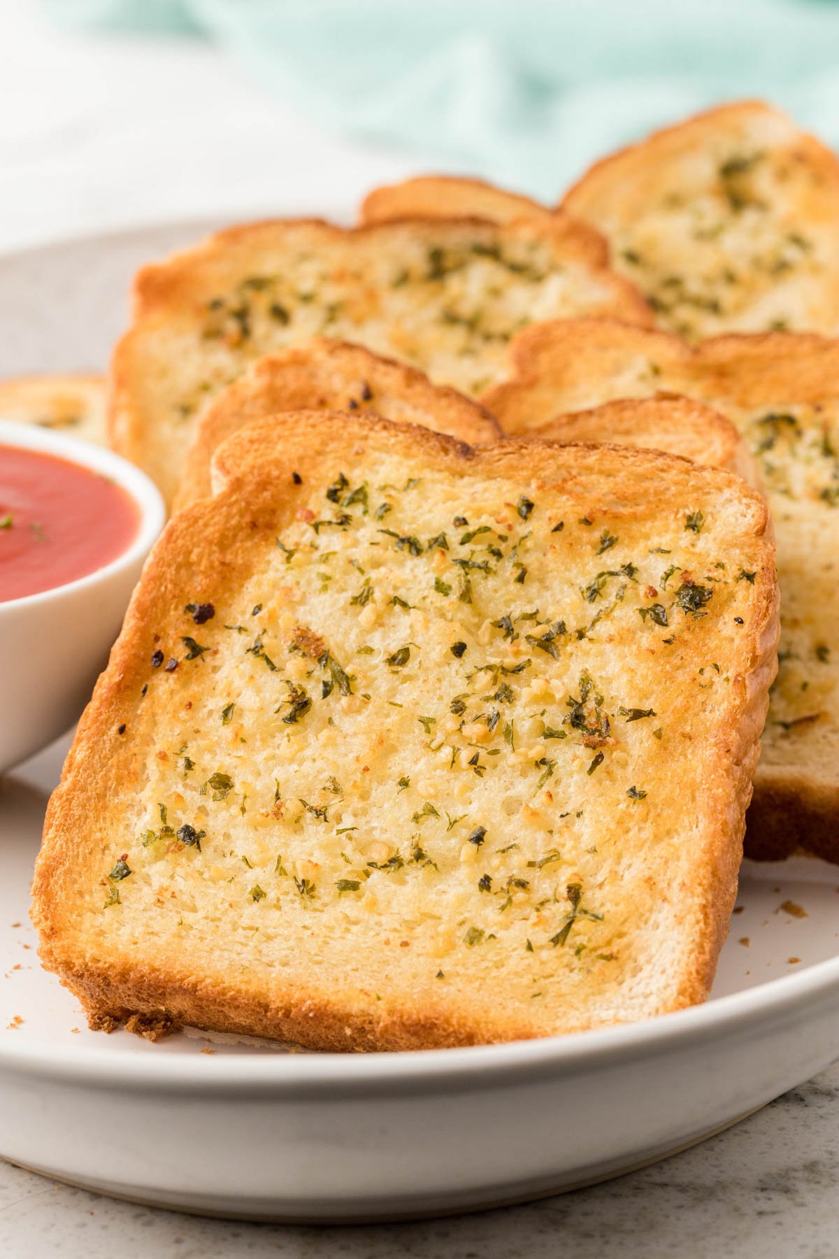 Texas Toast Garlic Bread on a white plate. 