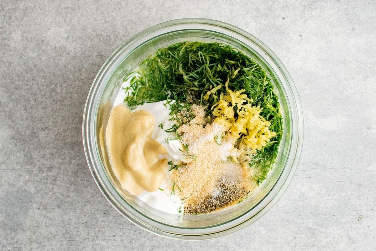 Ingredients for making lemon dill sauce in a bowl.