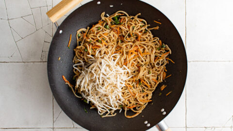 Pan Fried noodles and bean sprouts in a wok.