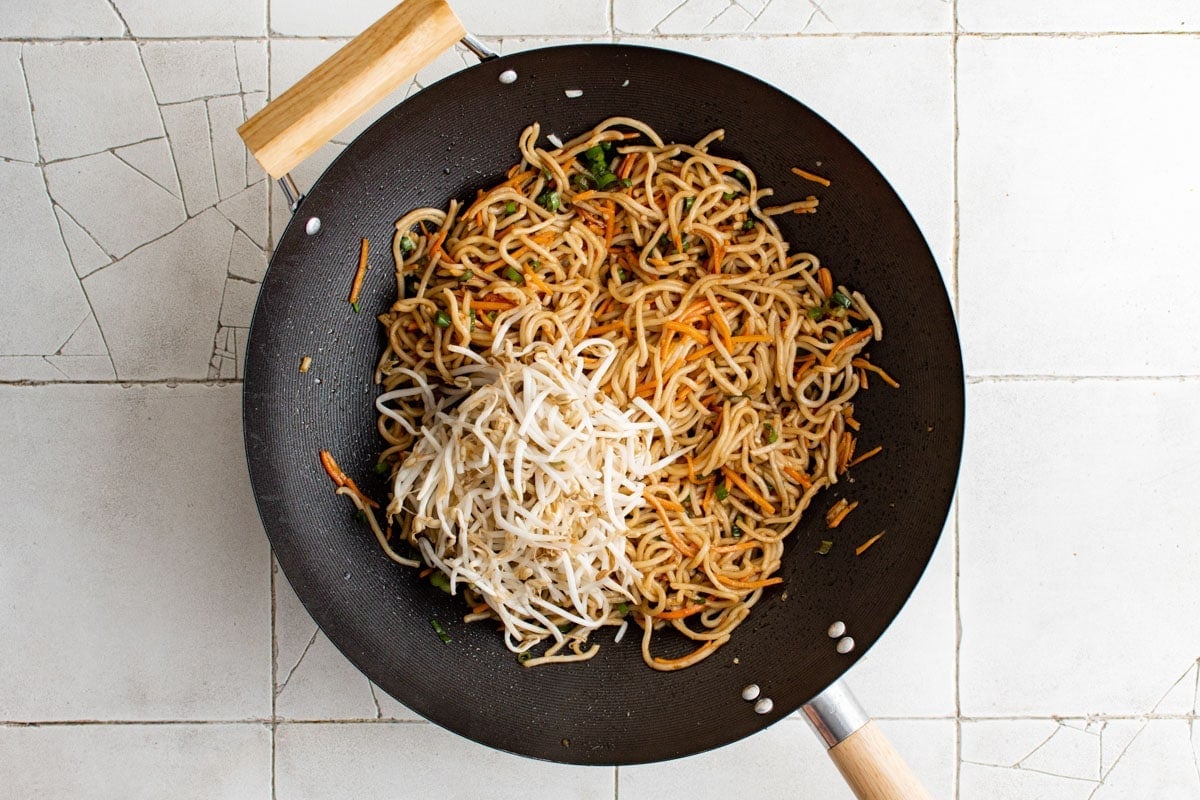 Pan Fried noodles and bean sprouts in a wok.