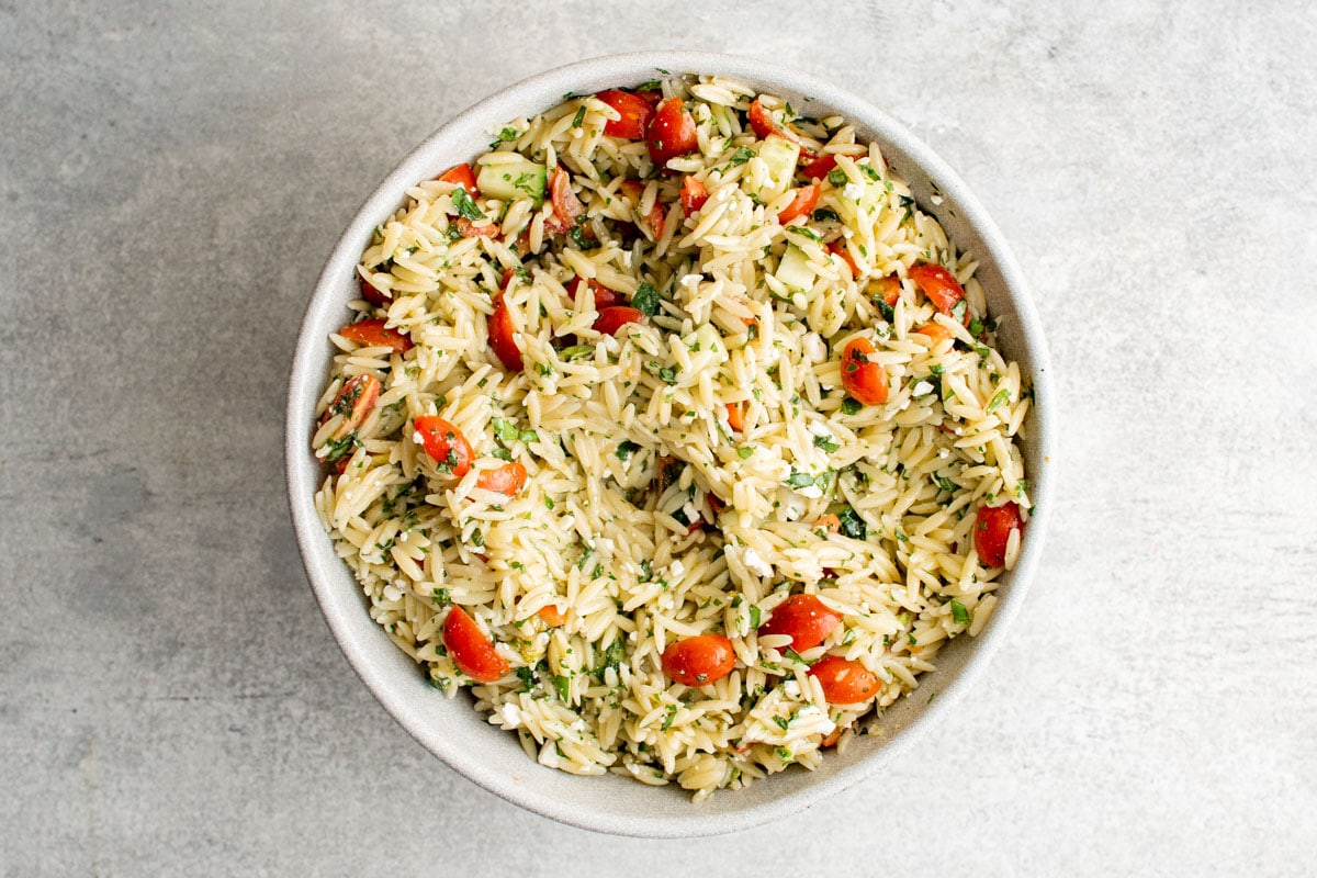 Mixed Orzo Salad in a white bowl.