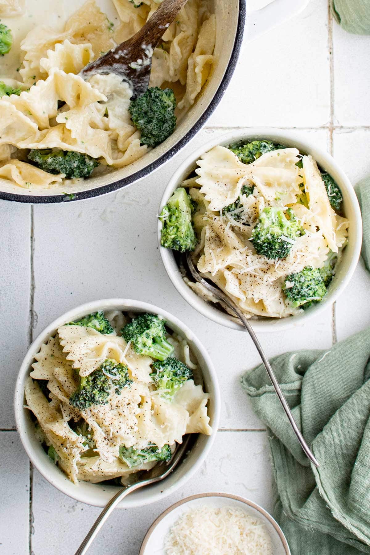 Broccoli and farfalle pasta in small bowls.