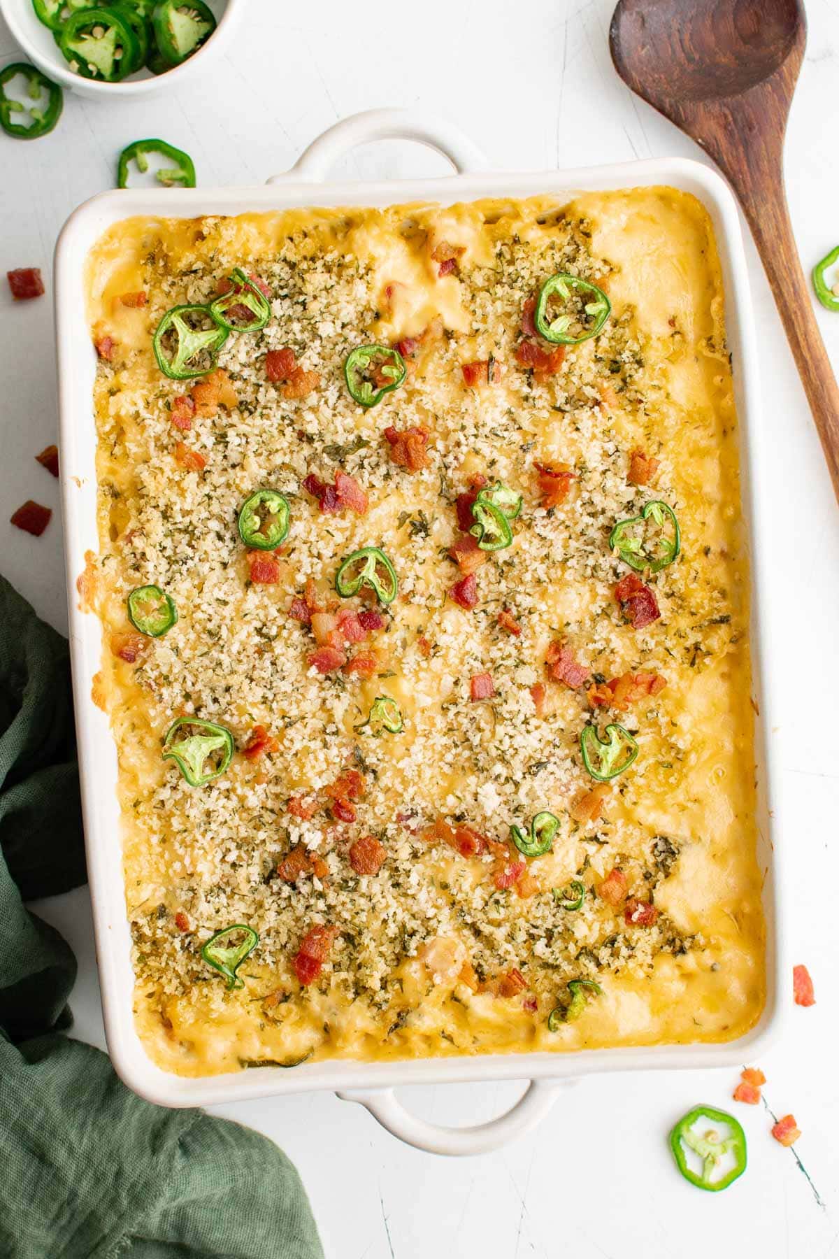 Pan of Mac and cheese with jalapenos bacon, and breadcrumb topping. 