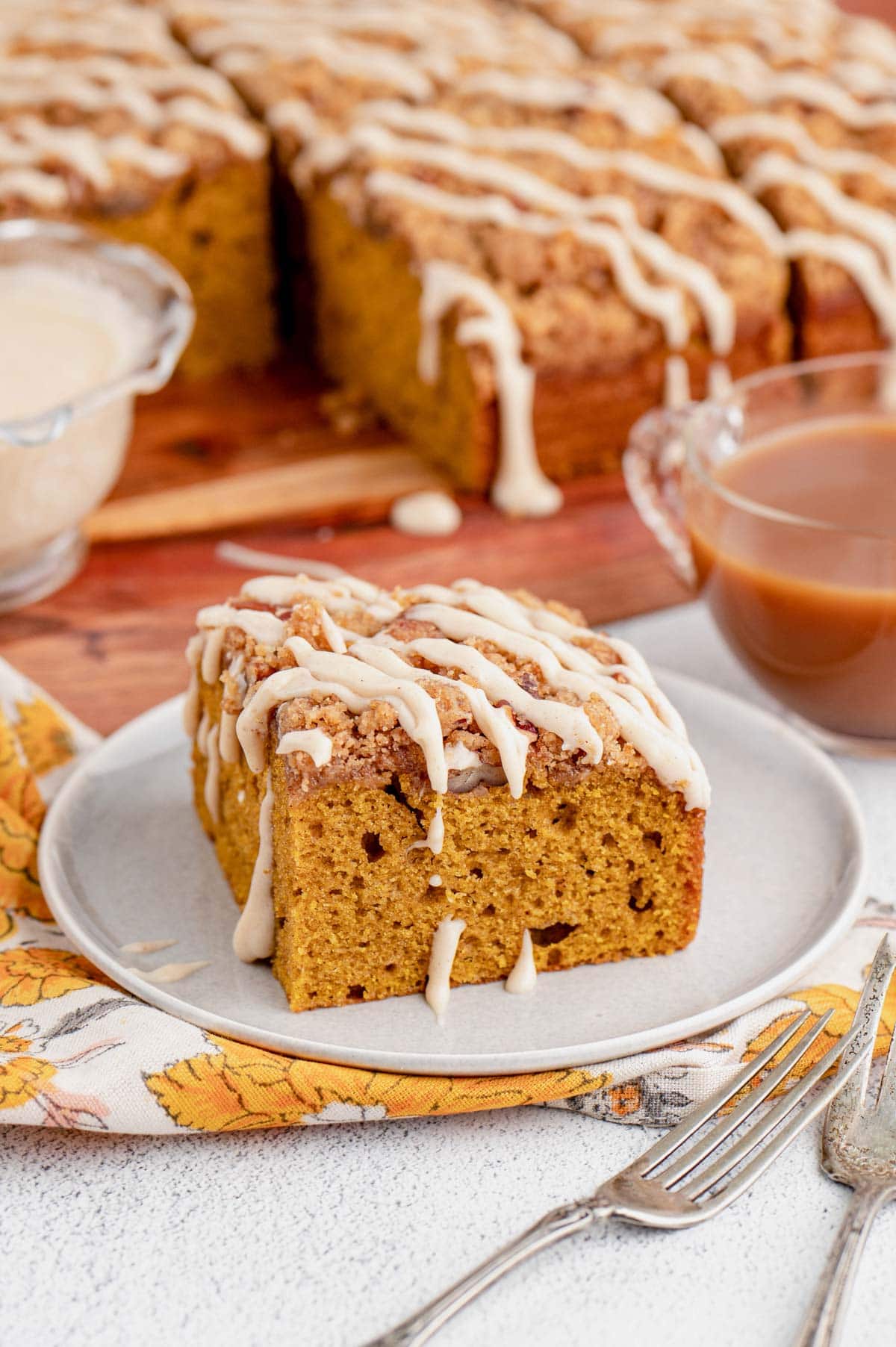 Square slice of pumpkin cake on a small plate   