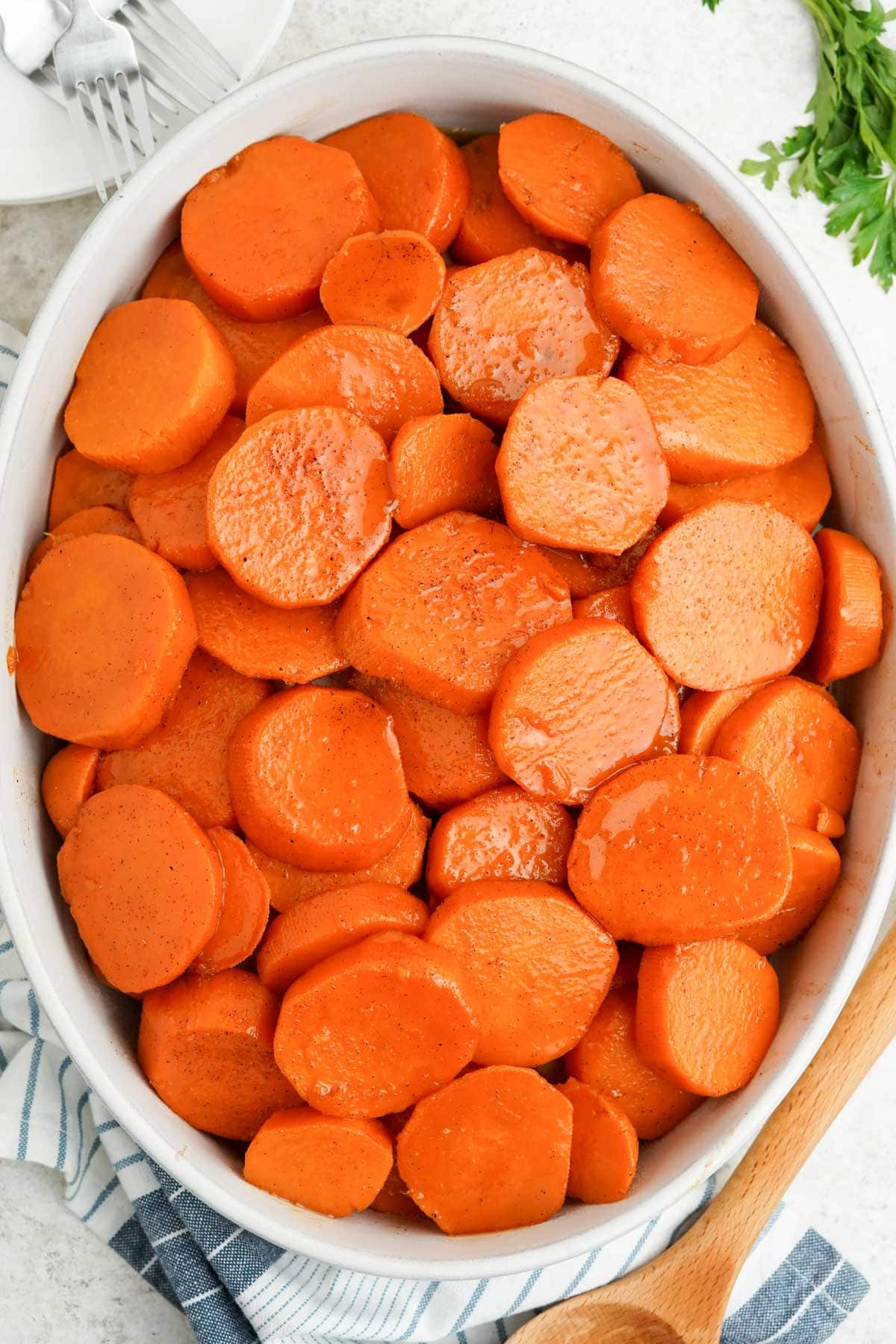 Candied yams in a large white casserole dish.