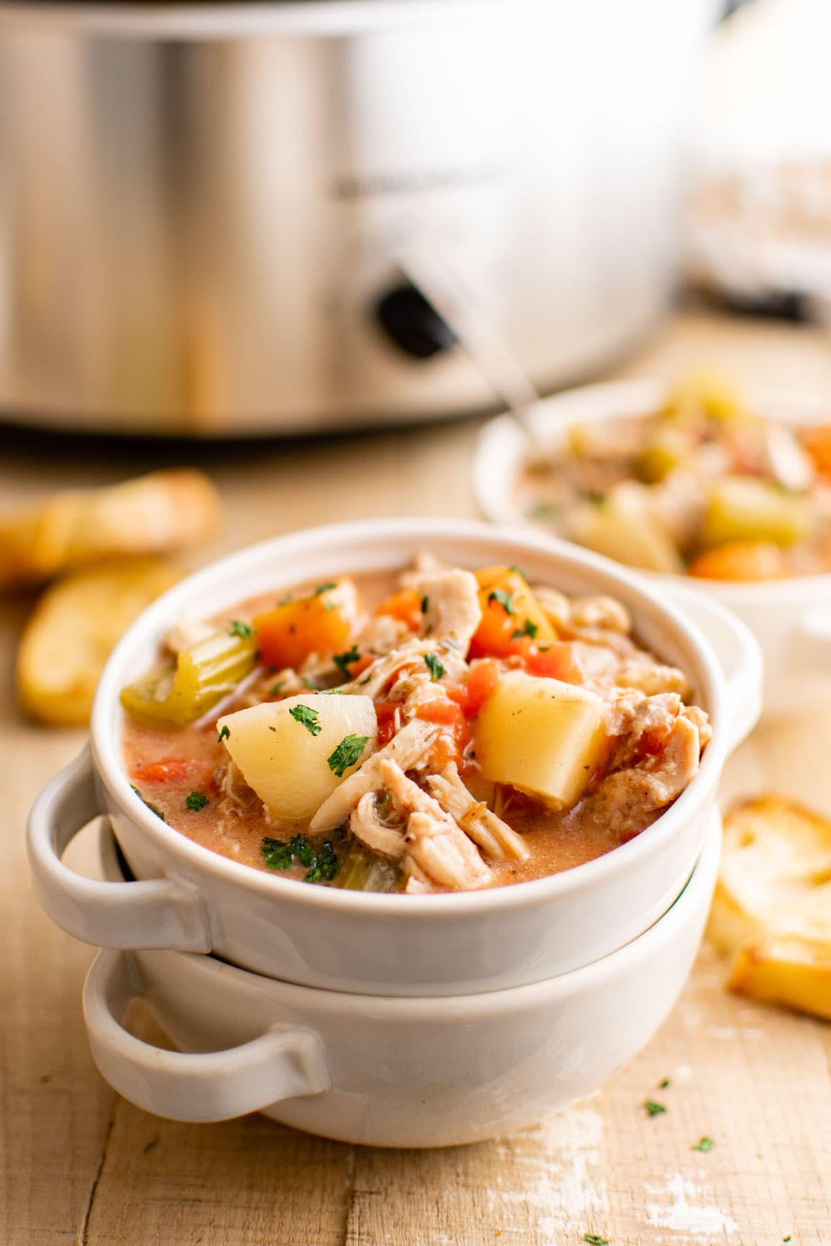 Stacked soup bowls with chicken stew.