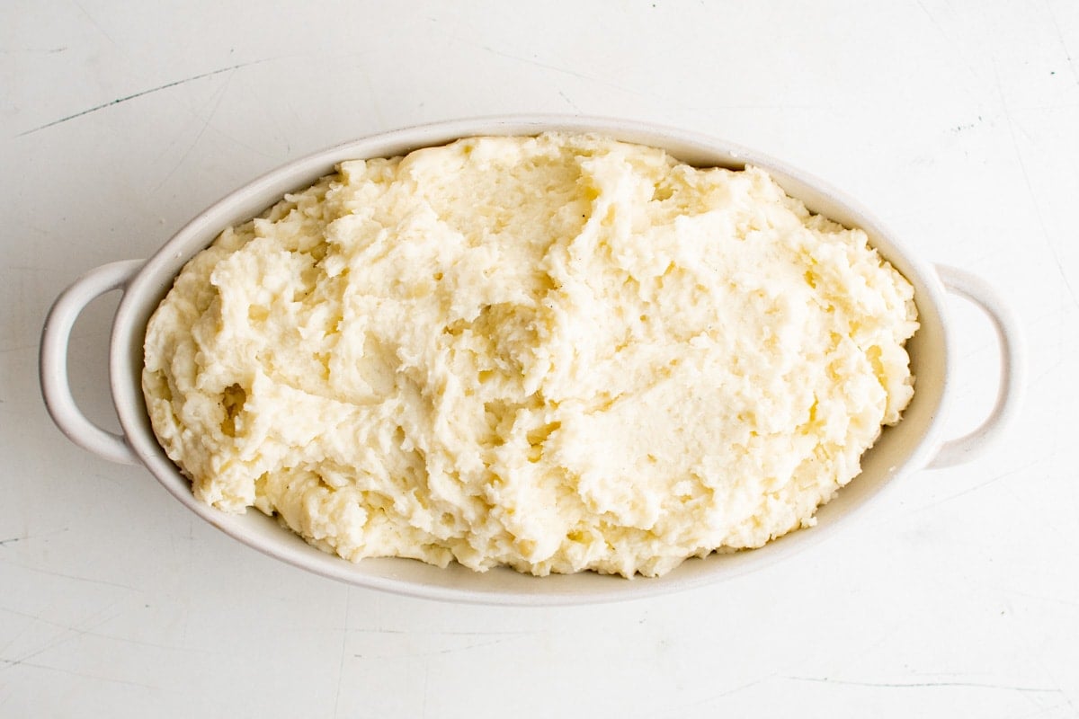 Mashed potatoes in a large casserole dish.