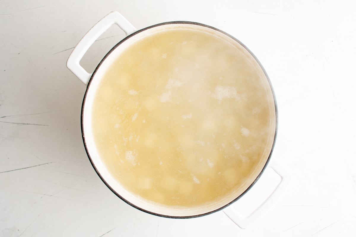 Diced potatoes in boiling water.