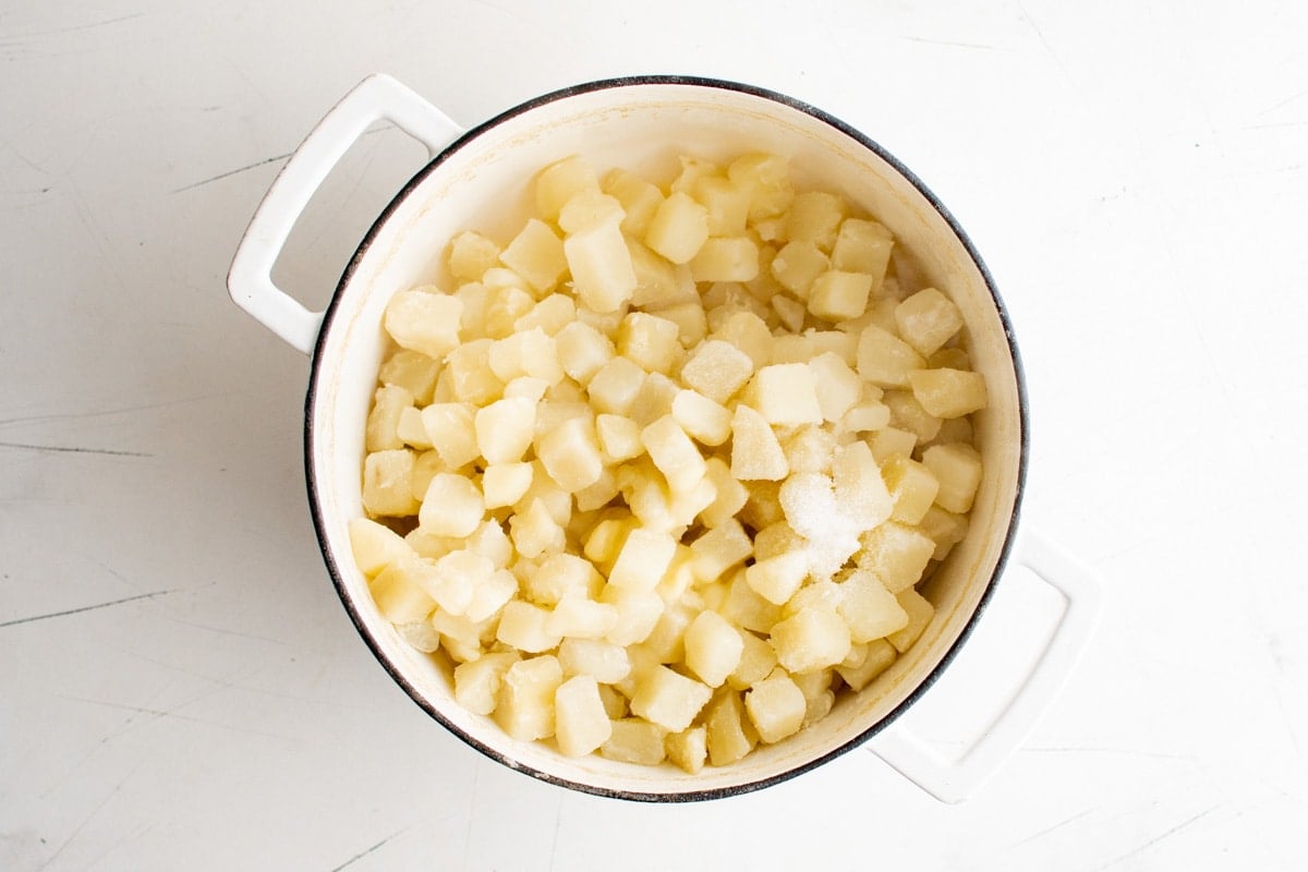 Diced potatoes in a large pot.
