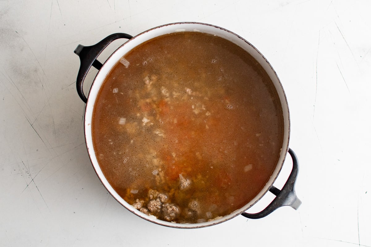 Ground beef in a tomato beef broth.