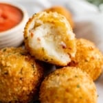 Fried mashed potato balls in a pile.