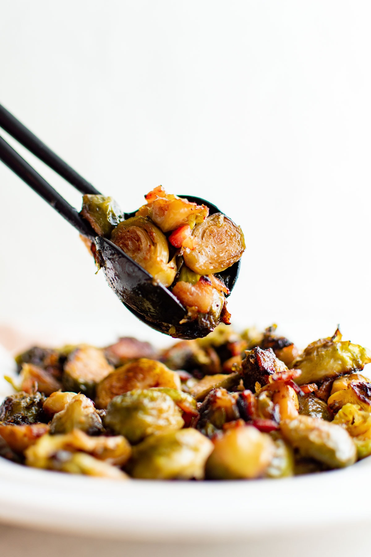 Serving spoons with roasted brussels sprouts.