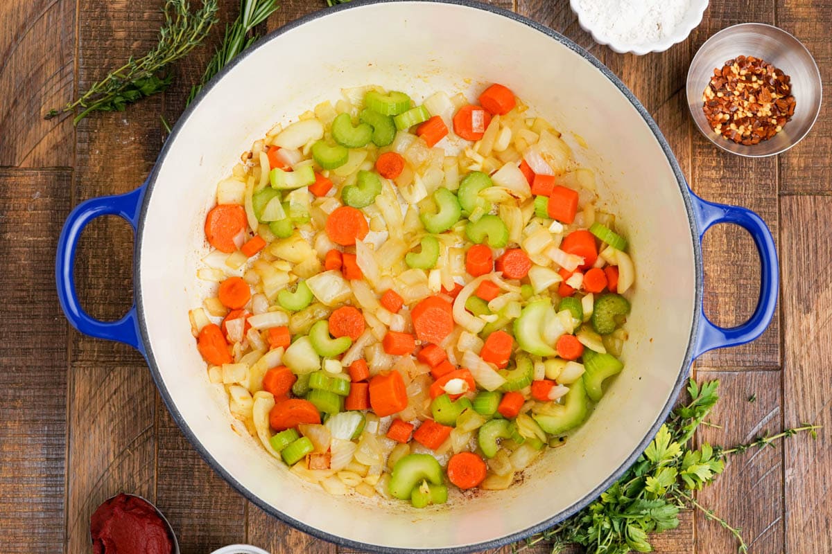 Chopped carrots and celery in a large pot.