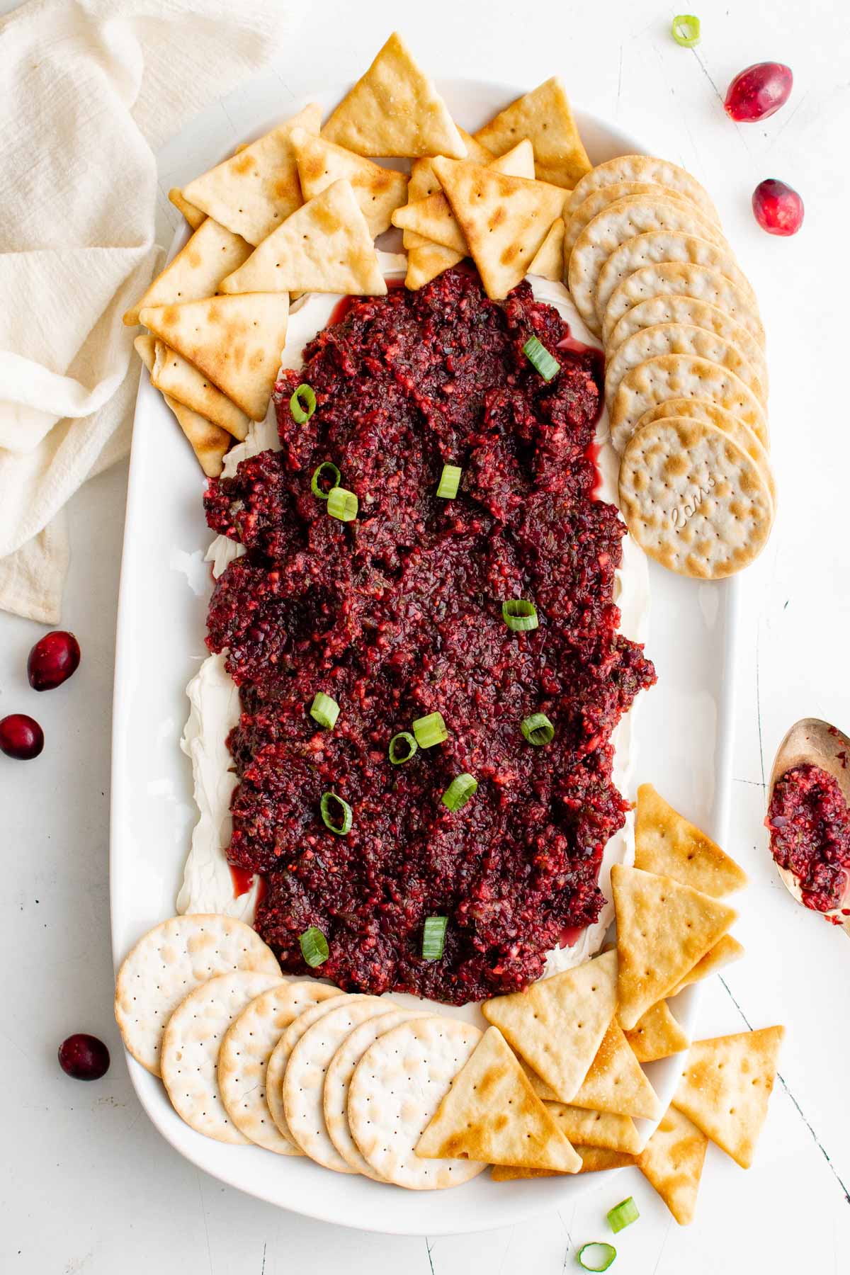 Cranberry Jalapeno Dip on top of cream cheese, with crackers.