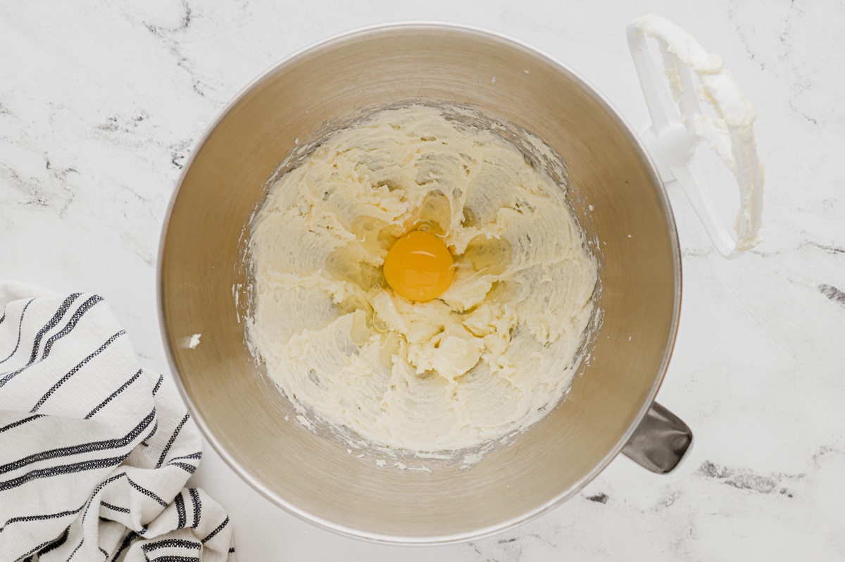 Egg, butter and sugar creamed together in a mixing bowl.