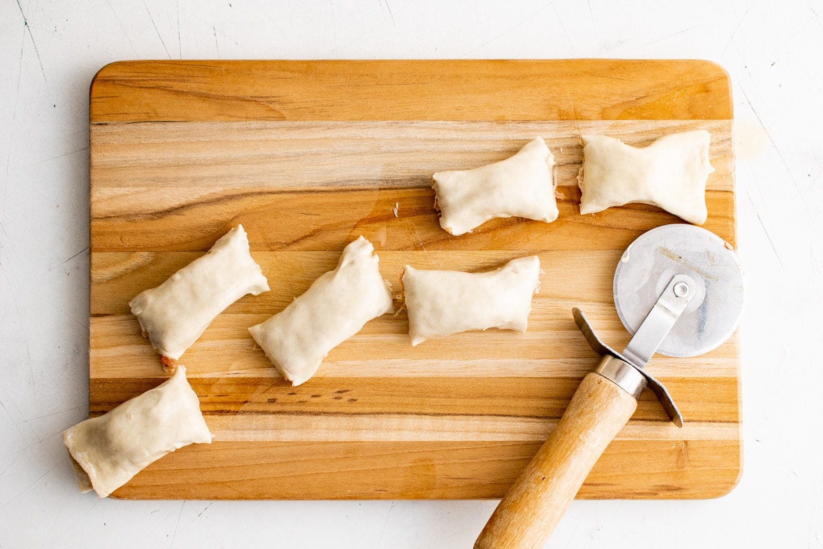 Puff pastry around sausage cut into pieces.