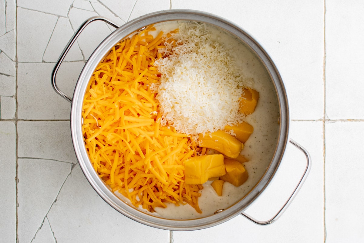 Cheeses added to the pot to make the cheese sauce.