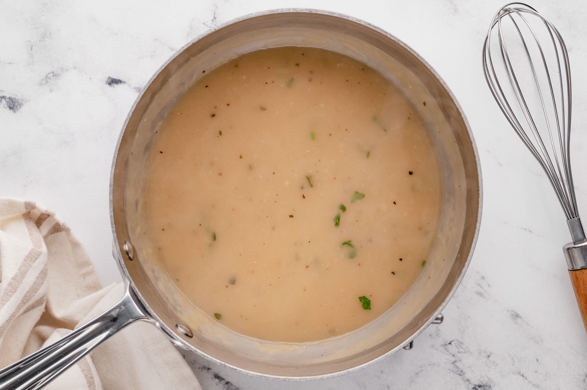 Gravy in a sauce pan.