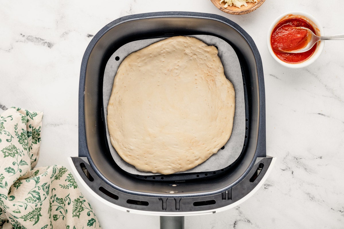 Pizza dough in an air fryer.