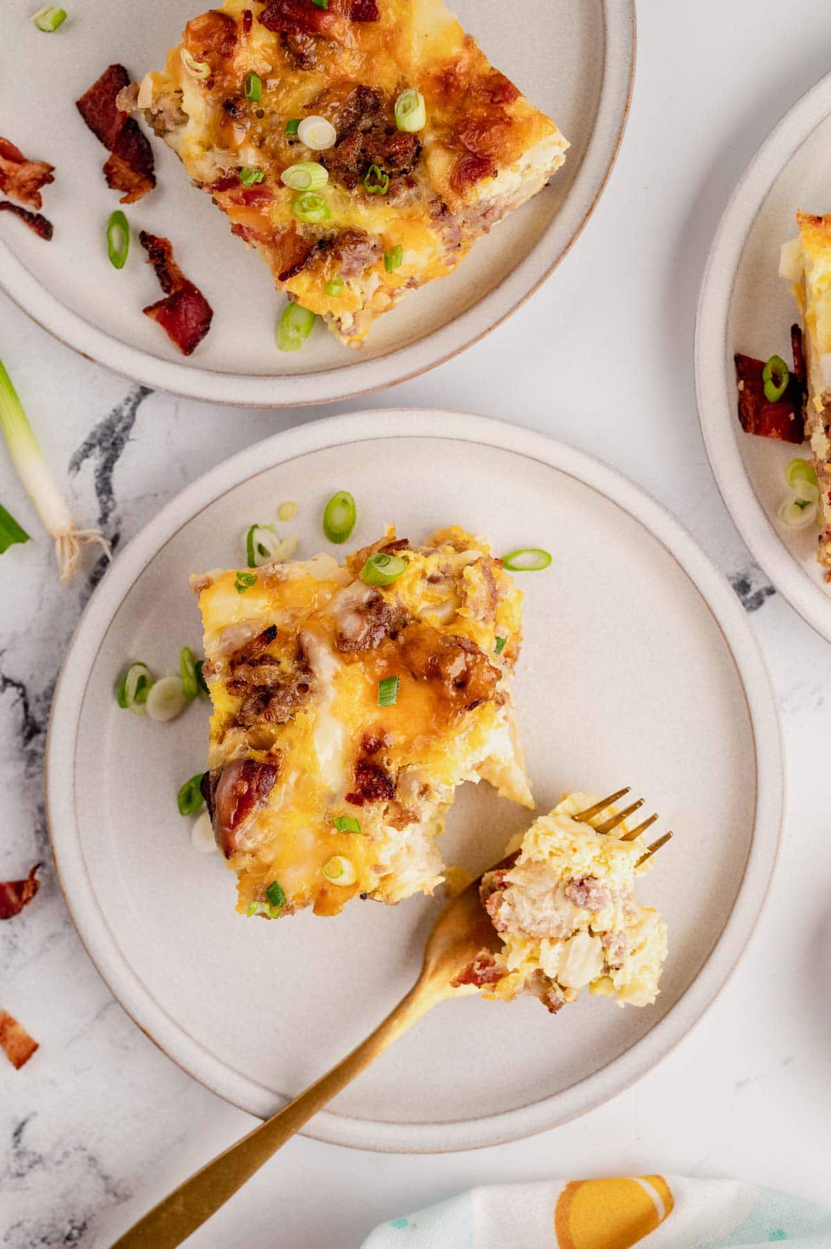 Close up of breakfast casserole with a fork.