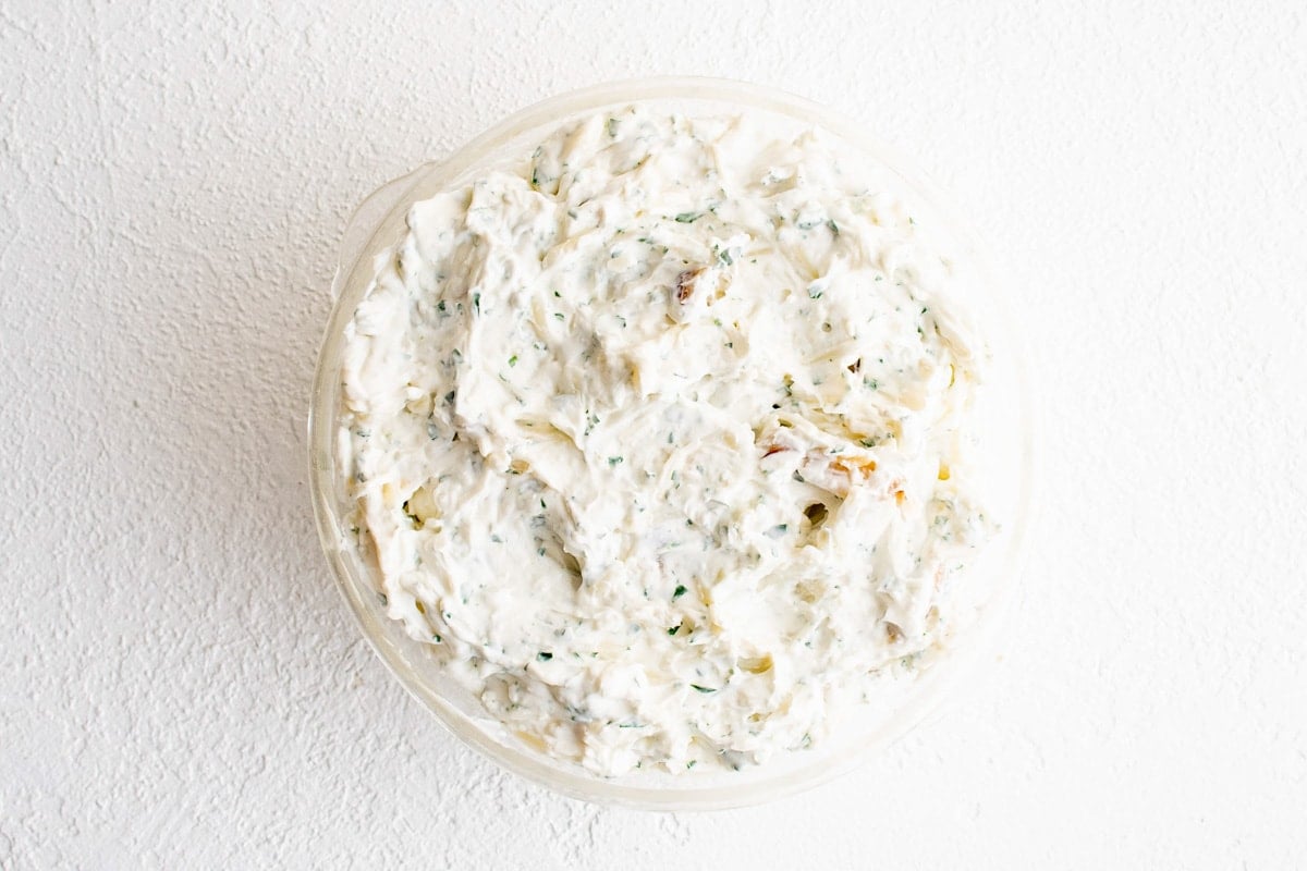 Garlic cheese dip in a round baking dish.