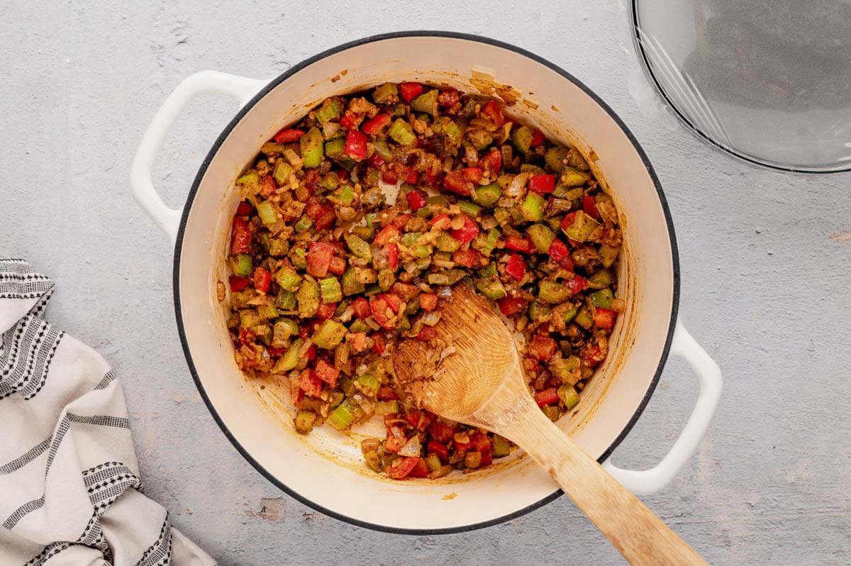 Cooked vegetables with flour in a dutch oven.