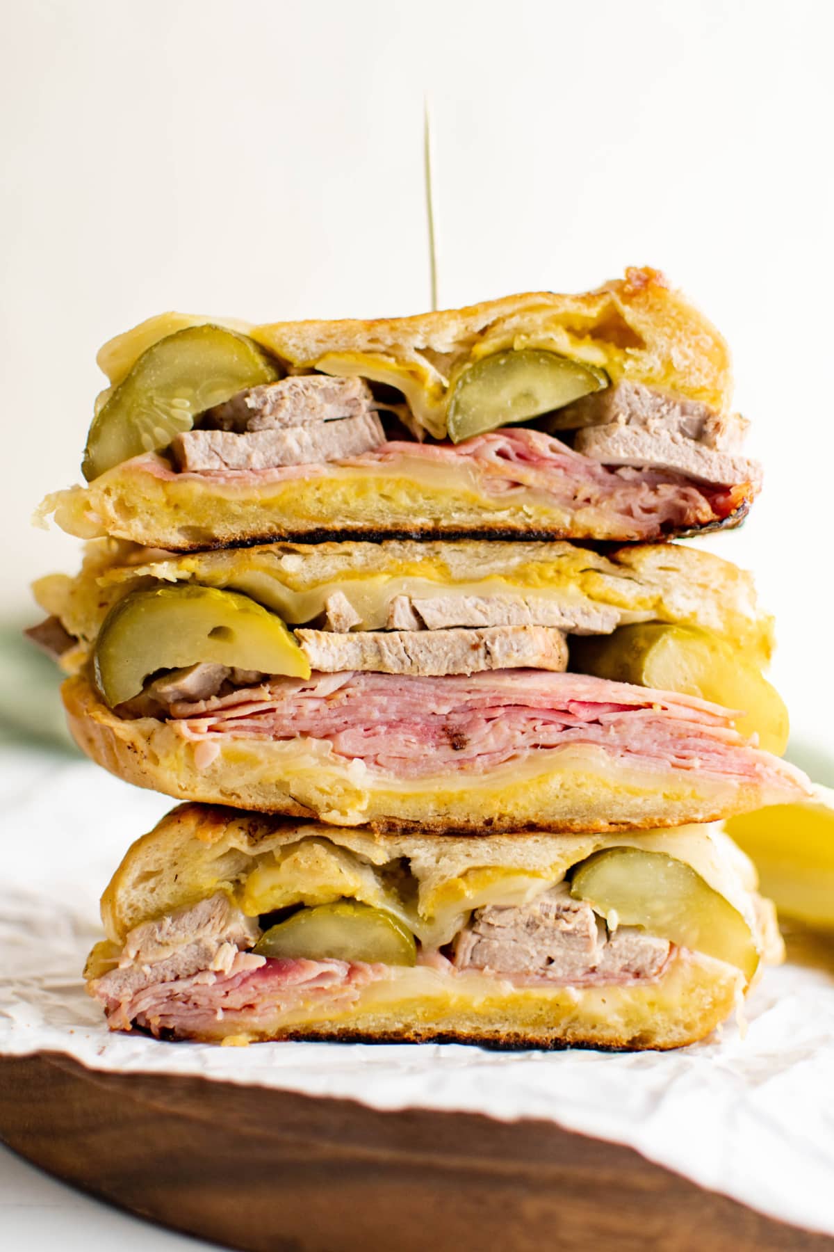 Stacked halves of cuban sandwich.