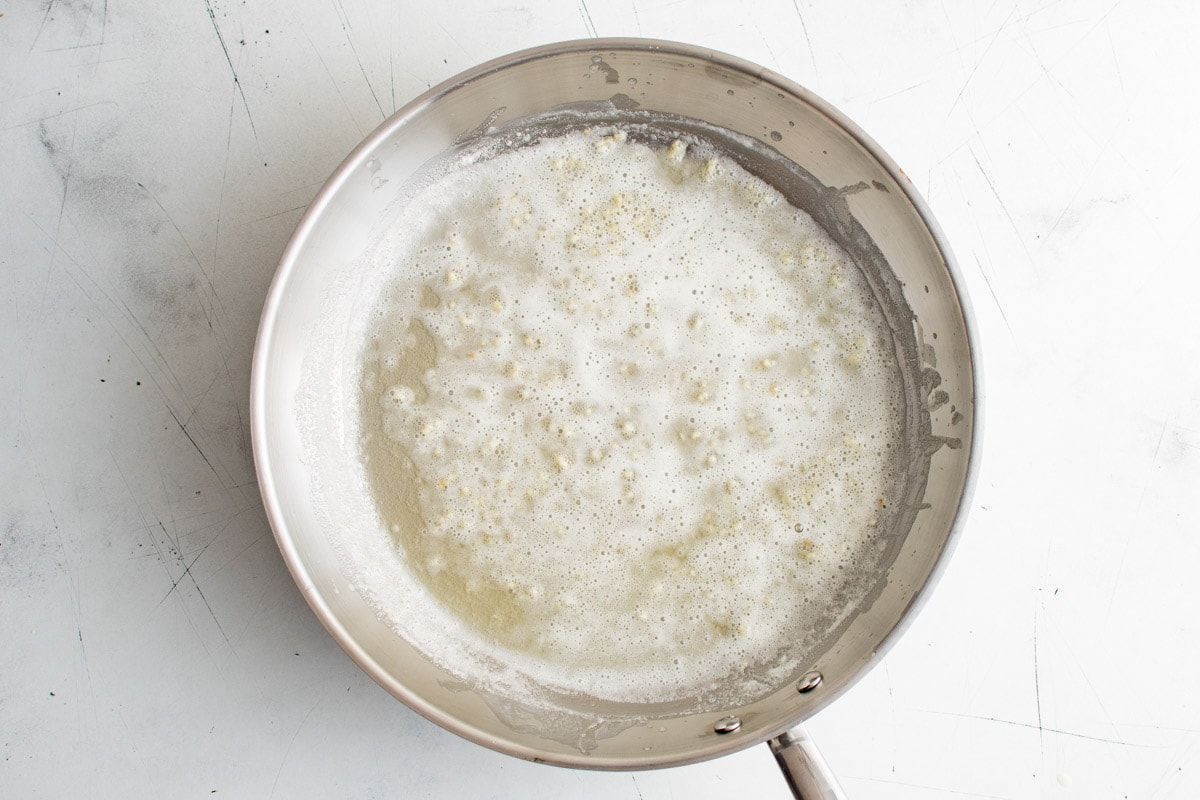 Melted butter and garlic in a skillet.