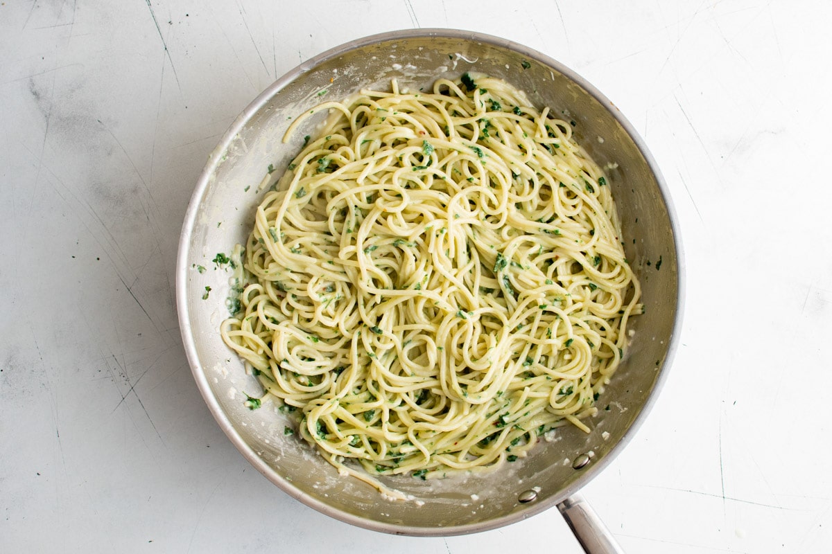 Spaghetti in garlic butter sauce with parsley.