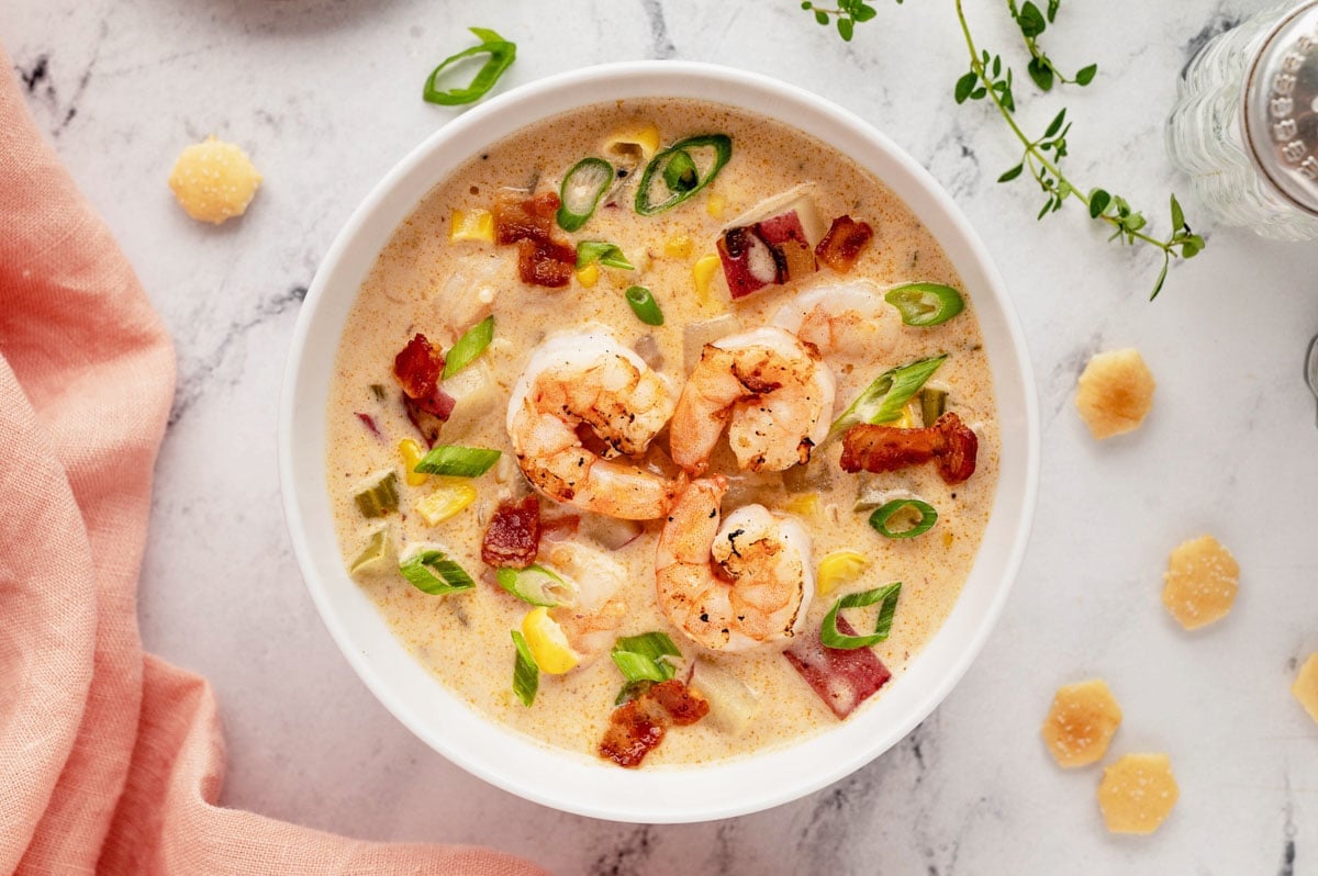 Shrimp corn chowder in a white bowl.