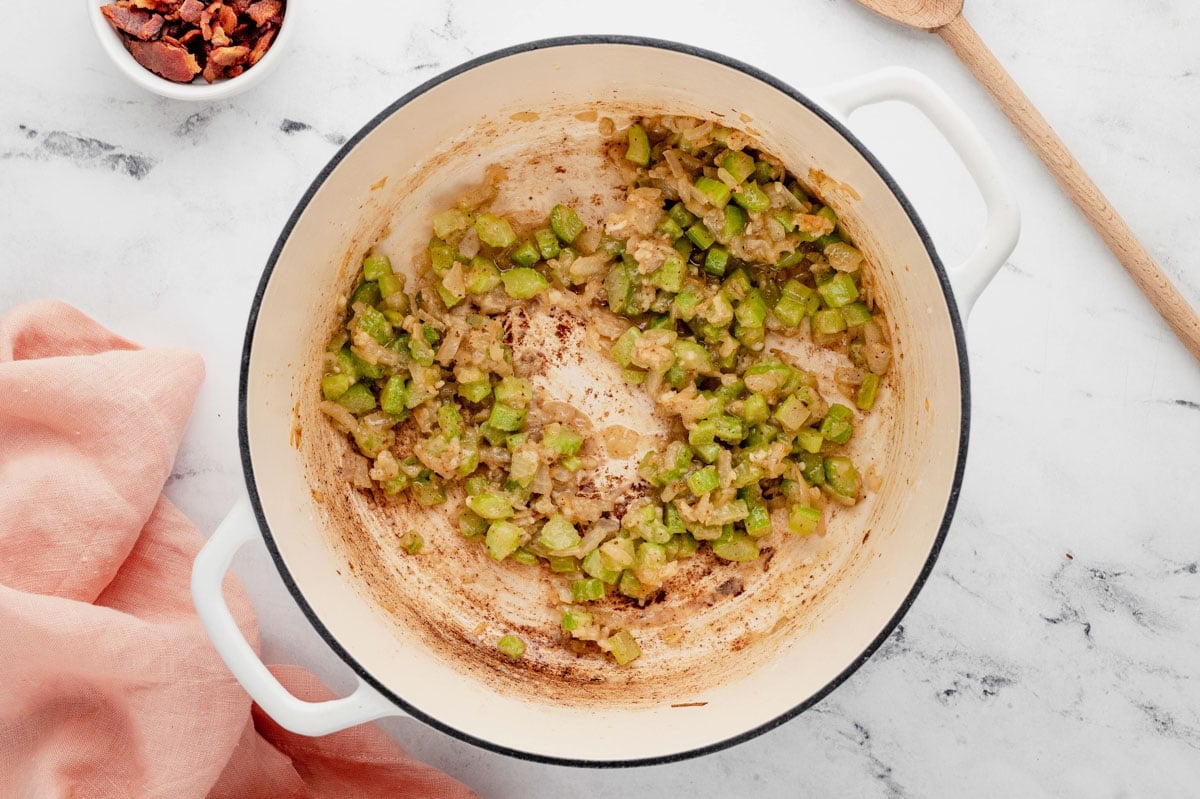 Cooked flour and diced celery in a large pot.