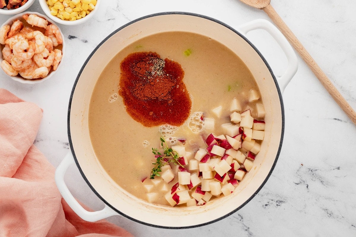 Creamy broth with diced potatoes and paprika.