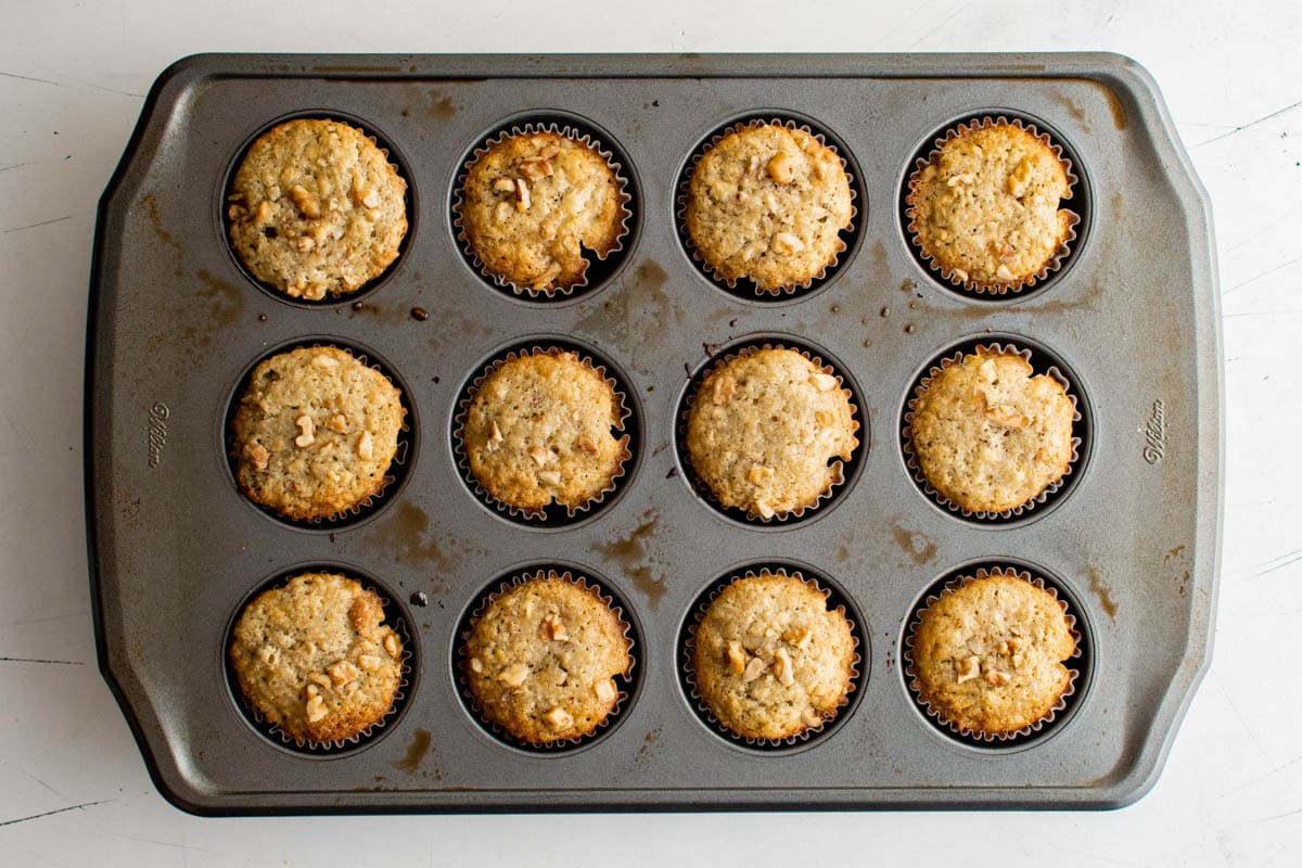 Finishsed banana muffins in a muffin pan.