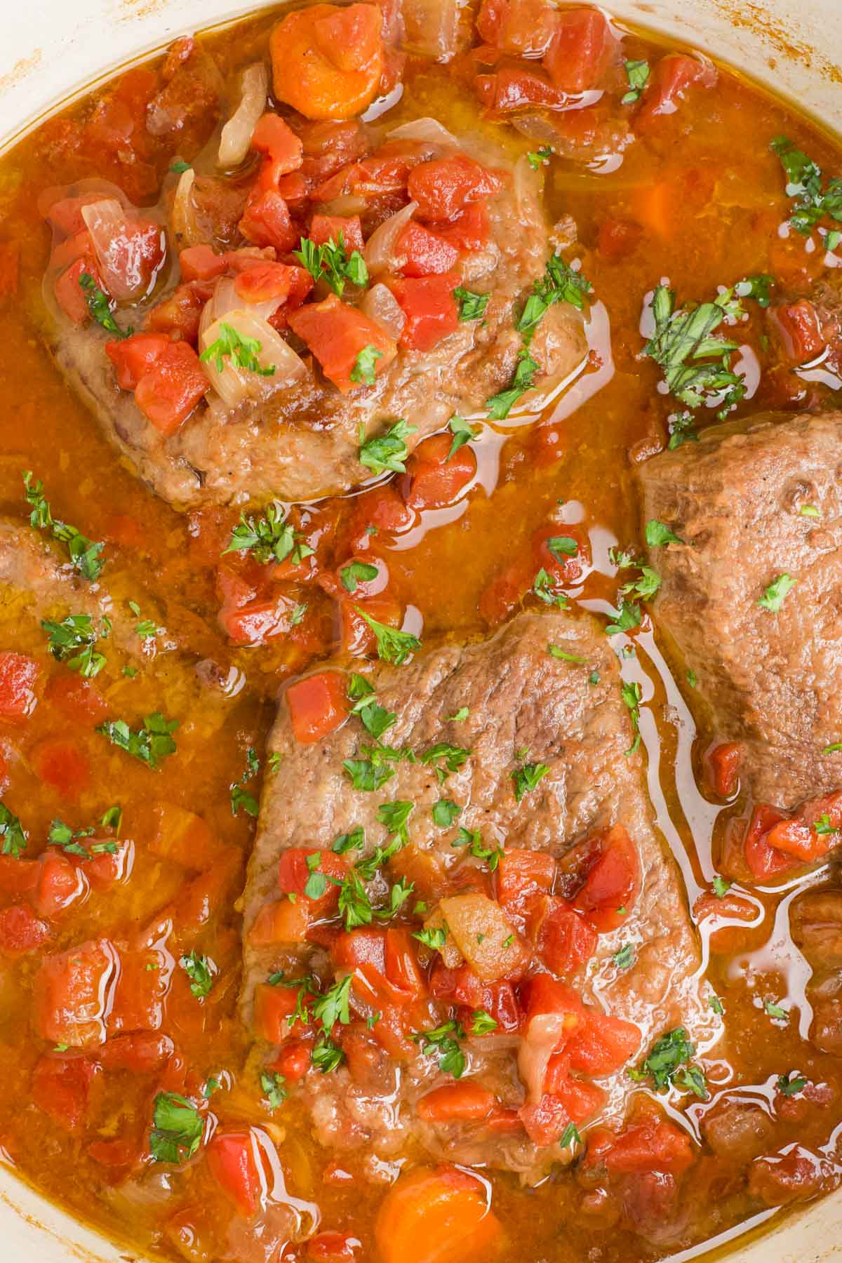 Swiss steaks in tomato and beef broth gravy.