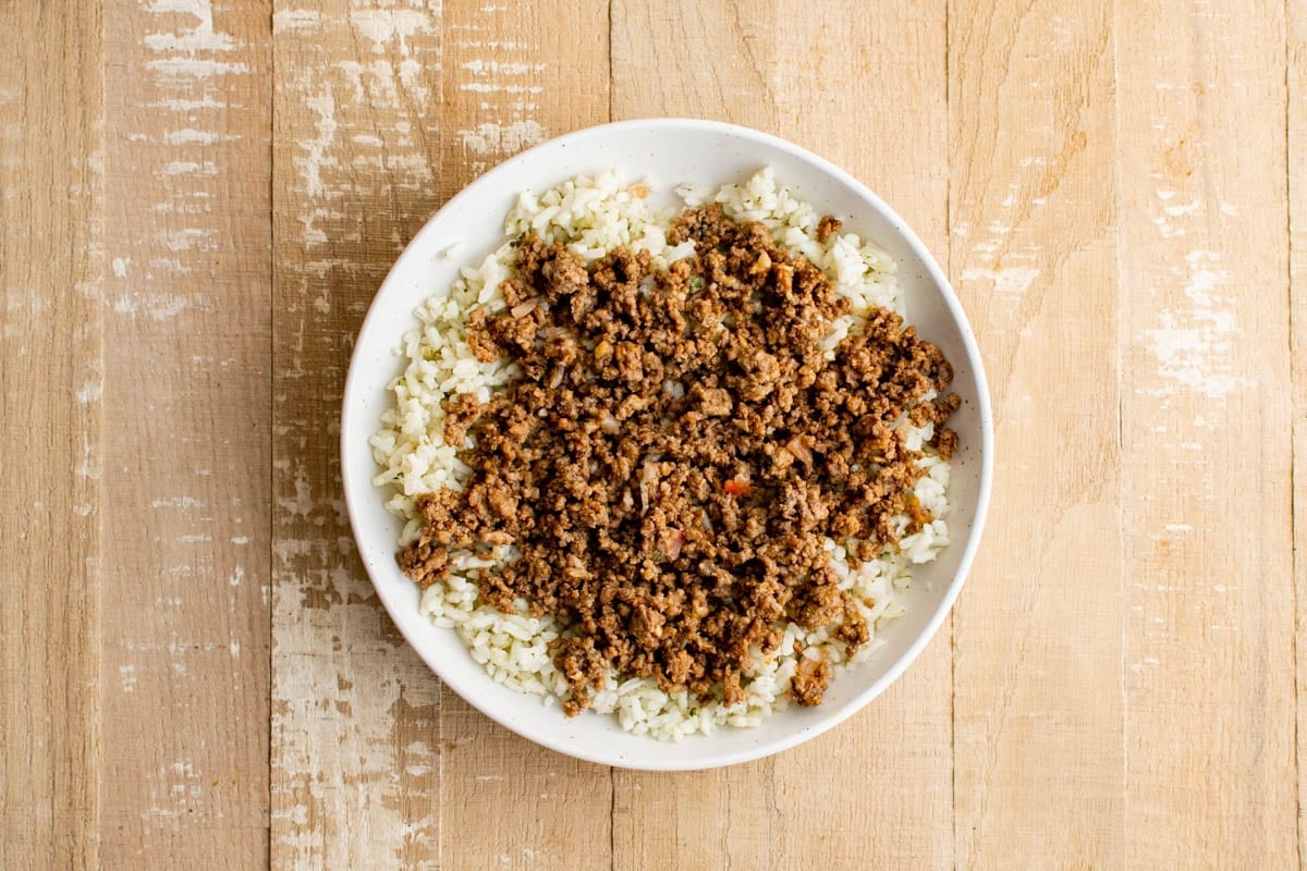 Rice and taco meat in a bowl.