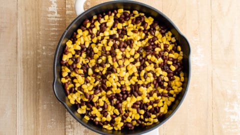Black beans and corn in a large skillet.