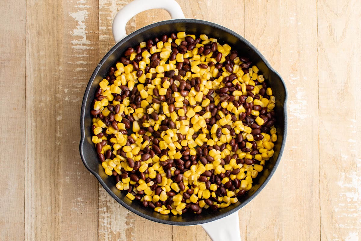 Black beans and corn in a large skillet.