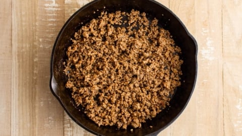 Ground beef taco meat in a cast iron skillet.
