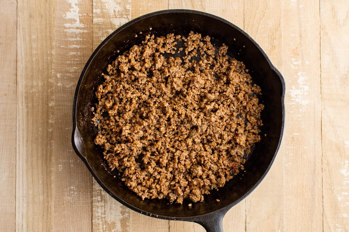 Ground beef taco meat in a cast iron skillet.