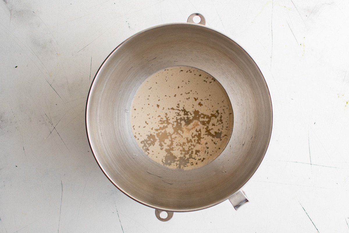 Yeast blooming in a bowl with water and sugar.