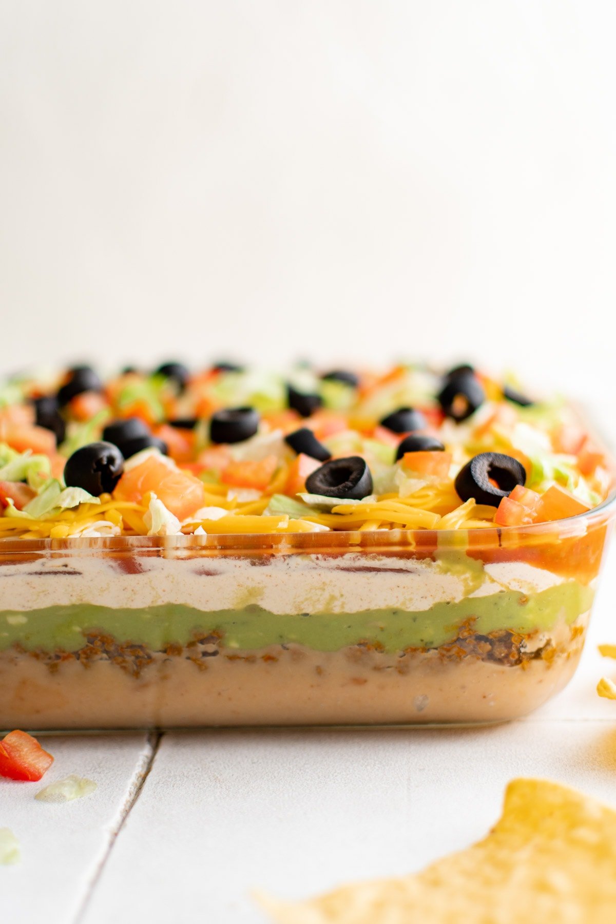 side of of layered taco dip showing the layers.