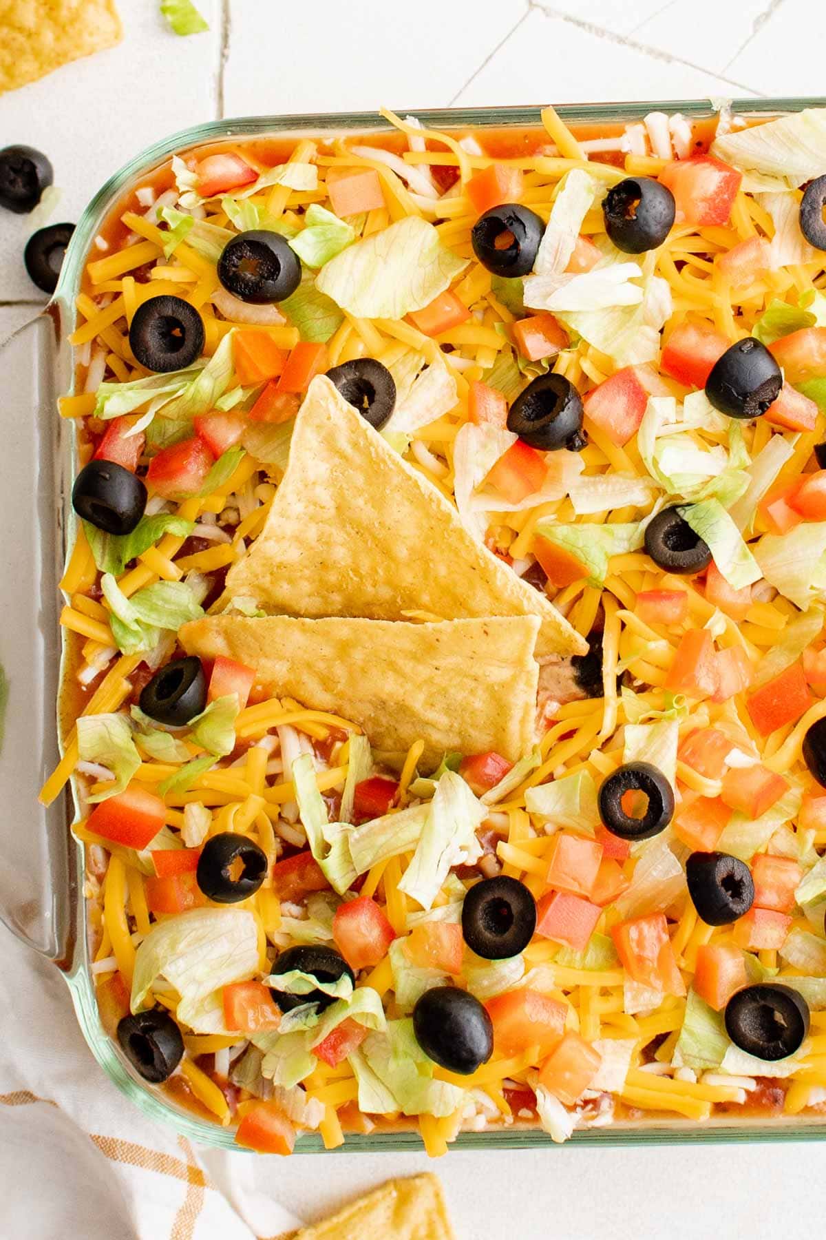 layered taco dip with chips.
