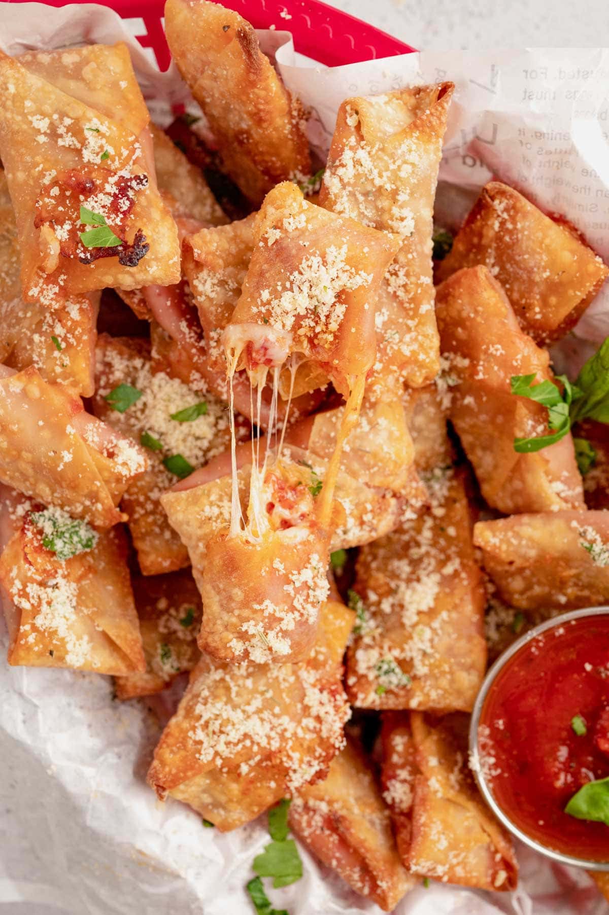 Air fryer pizza rolls packed into a basket.