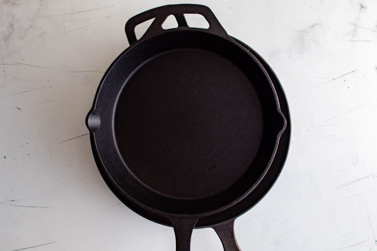 two skillets on top of each other.