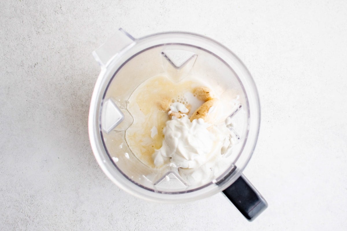 Yogurt, banana and juice in a blender.