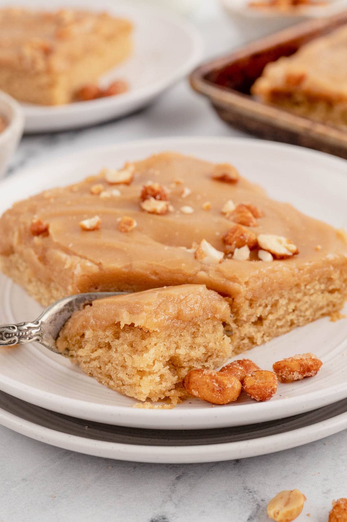 Slice of peanut butter cake with a fork.