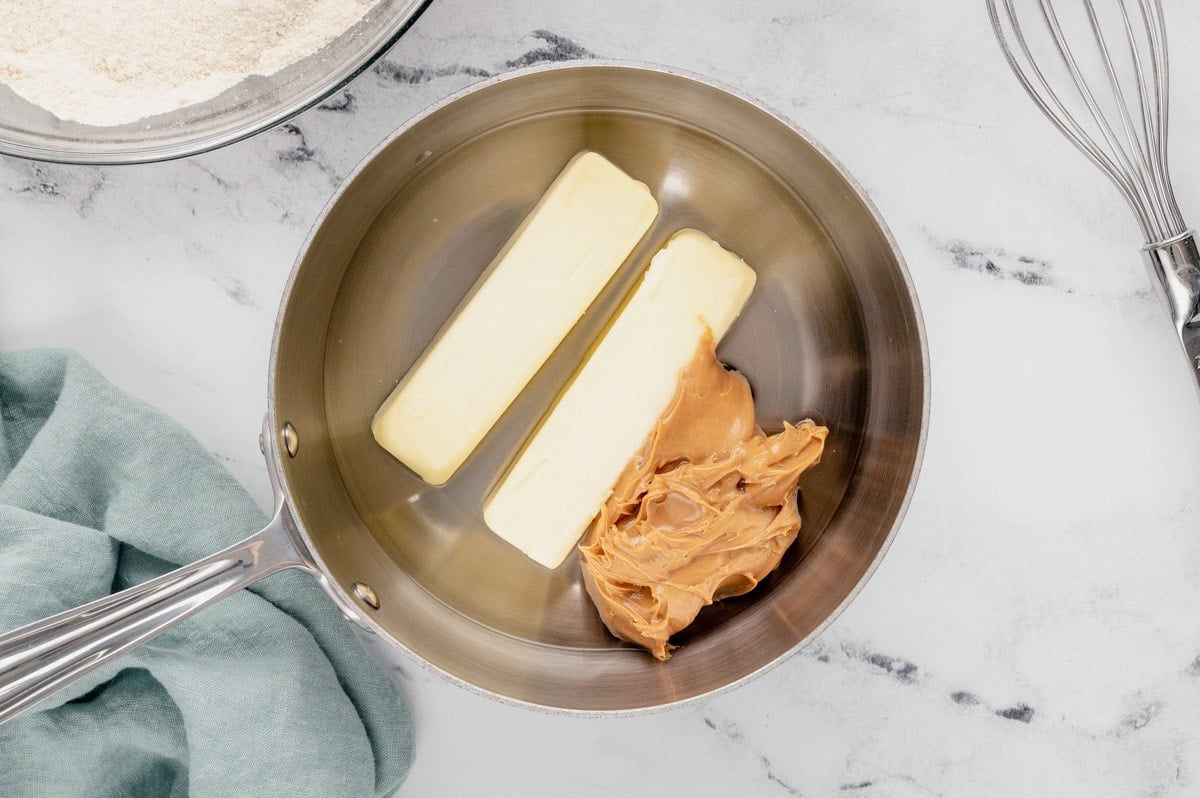 2 sticks of butter and peanut butter in a pot.